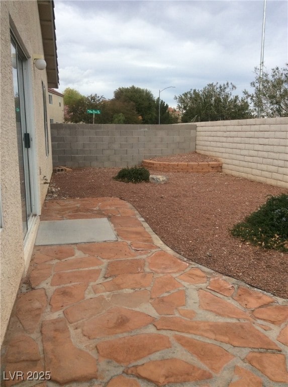 7864 Nesting Pine Pl, Las Vegas, NV 89143 - fenced backyard with a patio area