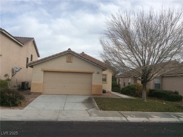 7864 Nesting Pine Pl, Las Vegas, NV 89143 - view of front facade featuring an attached garage, stucco siding, driveway, and a tile roof
