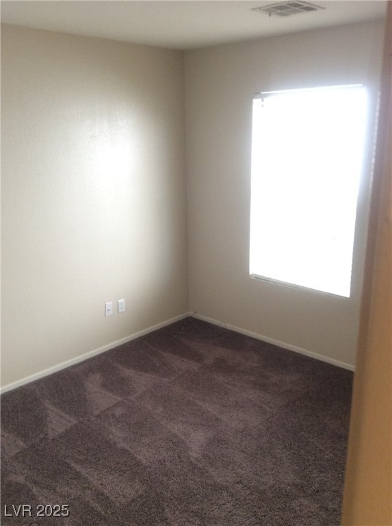 7864 Nesting Pine Pl, Las Vegas, NV 89143 - empty room featuring dark carpet and baseboards