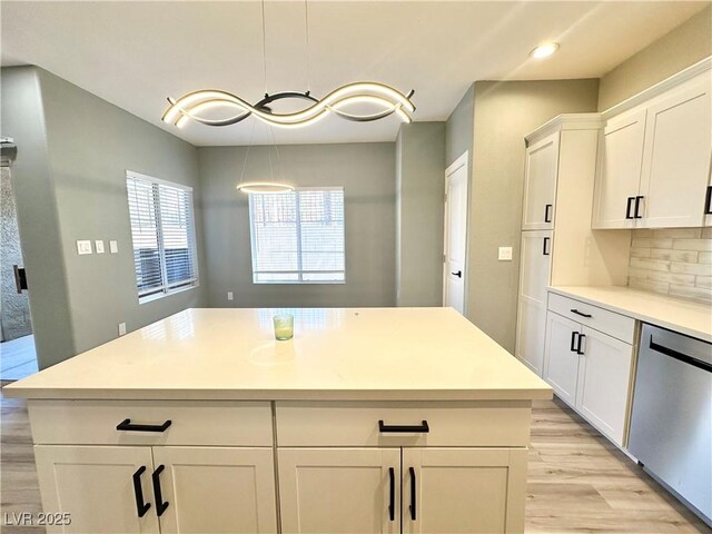 9000 Las Vegas Blvd Unit 1078, Las Vegas, NV 89123 - kitchen with stainless steel dishwasher, light wood-type flooring, white cabinets, light countertops, and recessed lighting