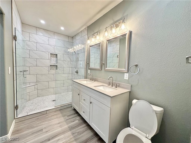 9000 Las Vegas Blvd Unit 1078, Las Vegas, NV 89123 - full bathroom with a tile shower, double vanity, wood finished floors, and recessed lighting