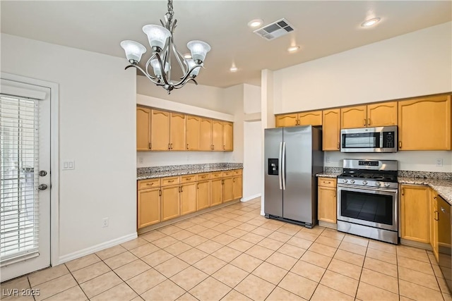 3308 Morning Wind Ln, Las Vegas, NV 89129 - kitchen featuring stainless steel appliances, a chandelier, light stone countertops, light tile patterned flooring, and decorative light fixtures