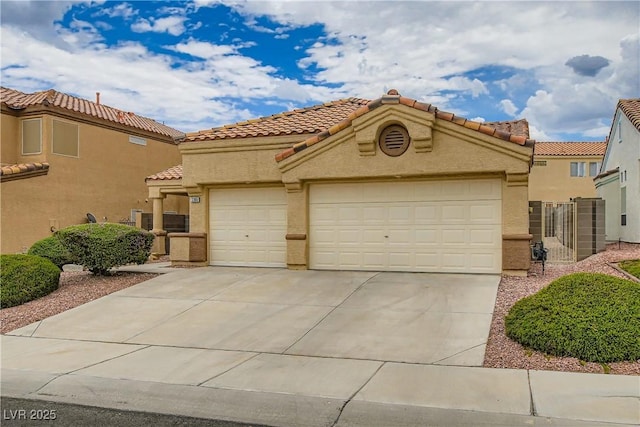 3308 Morning Wind Ln, Las Vegas, NV 89129 - mediterranean / spanish house featuring a garage, stucco siding, concrete driveway, and a tile roof