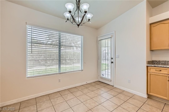 3308 Morning Wind Ln, Las Vegas, NV 89129 - unfurnished dining area with a chandelier and light tile patterned floors