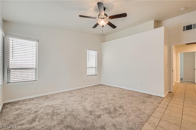 3308 Morning Wind Ln, Las Vegas, NV 89129 - unfurnished room with ceiling fan, a smoke detector, light tile patterned floors, and light carpet