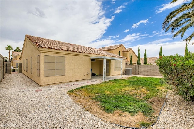 3308 Morning Wind Ln, Las Vegas, NV 89129 - rear view of property featuring stucco siding, a tiled roof, a fenced backyard, and a patio area