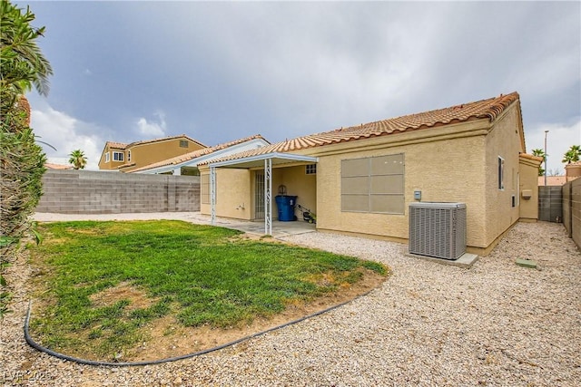 3308 Morning Wind Ln, Las Vegas, NV 89129 - back of property featuring stucco siding, a tile roof, a fenced backyard, and a patio