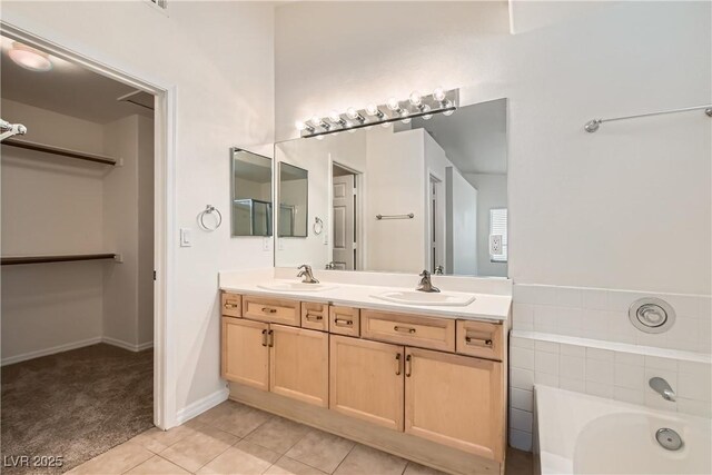 3308 Morning Wind Ln, Las Vegas, NV 89129 - full bathroom featuring double vanity, a bath, and tile patterned floors