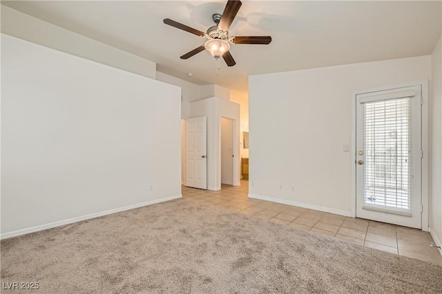 3308 Morning Wind Ln, Las Vegas, NV 89129 - empty room featuring tile patterned flooring, carpet flooring, and ceiling fan