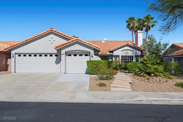 2408 Sunset Beach Ln, Las Vegas, NV 89128 - mediterranean / spanish-style house with an attached garage, a tiled roof, a chimney, concrete driveway, and stucco siding