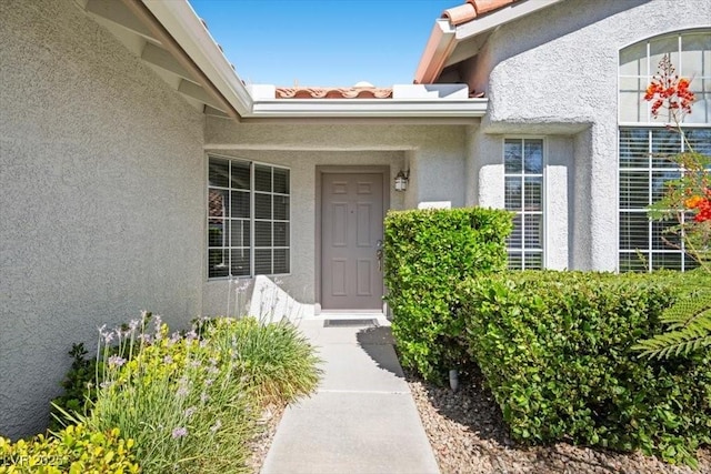 2408 Sunset Beach Ln, Las Vegas, NV 89128 - entrance to property featuring stucco siding and a tile roof