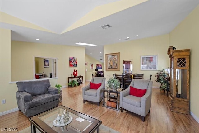 2408 Sunset Beach Ln, Las Vegas, NV 89128 - living room featuring vaulted ceiling, wood finished floors, and recessed lighting