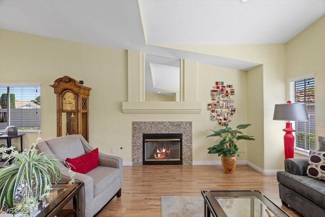 2408 Sunset Beach Ln, Las Vegas, NV 89128 - living room featuring wood finished floors and a glass covered fireplace