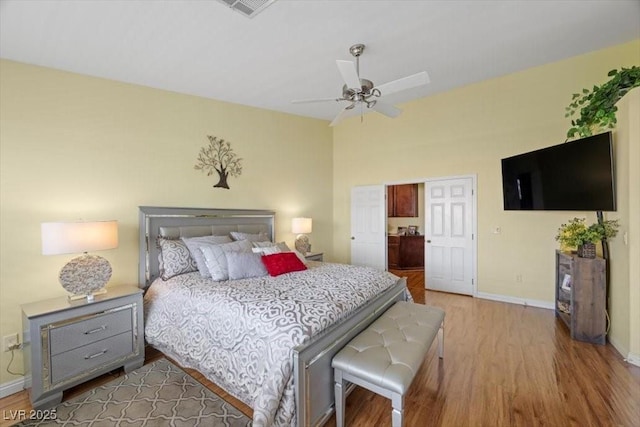 2408 Sunset Beach Ln, Las Vegas, NV 89128 - bedroom featuring wood finished floors, ensuite bathroom, and ceiling fan