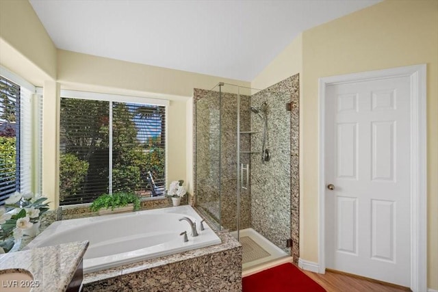 2408 Sunset Beach Ln, Las Vegas, NV 89128 - bathroom featuring a bath, a stall shower, and lofted ceiling