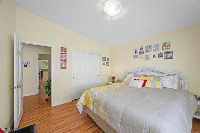 2408 Sunset Beach Ln, Las Vegas, NV 89128 - bedroom with lofted ceiling and wood finished floors