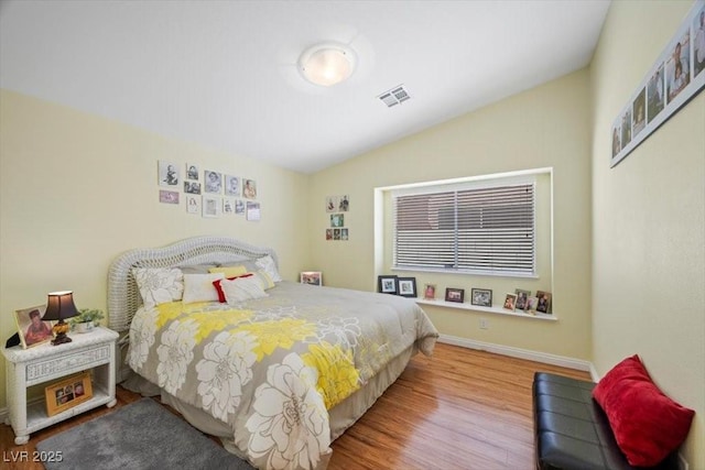 2408 Sunset Beach Ln, Las Vegas, NV 89128 - bedroom featuring vaulted ceiling and wood finished floors