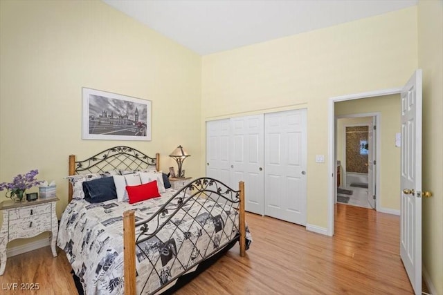 2408 Sunset Beach Ln, Las Vegas, NV 89128 - bedroom featuring light wood-style flooring and a closet