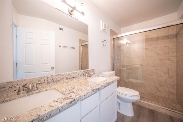 7950 W Flamingo Rd Unit 1009, Las Vegas, NV 89147 - full bath with a shower stall, wood finished floors, and double vanity