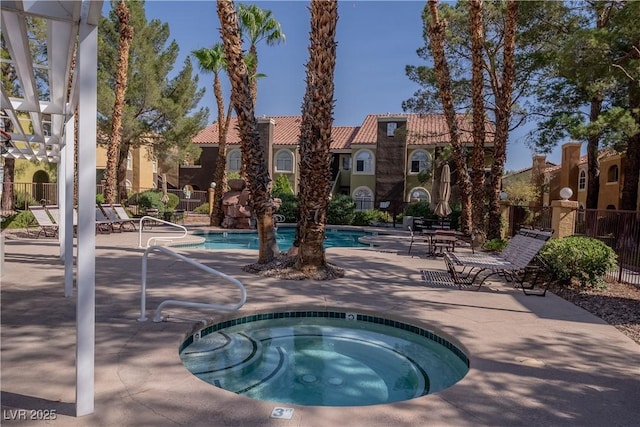 7950 W Flamingo Rd Unit 1009, Las Vegas, NV 89147 - community pool with a community hot tub and a patio