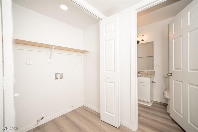 7950 W Flamingo Rd Unit 1009, Las Vegas, NV 89147 - laundry area with washer hookup, light wood finished floors, gas dryer hookup, and recessed lighting
