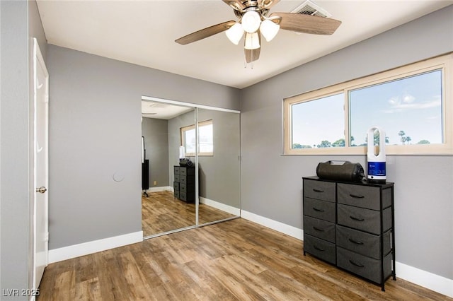 6457 Celeste Ave, Las Vegas, NV 89107 - bedroom featuring wood finished floors, a closet, and ceiling fan