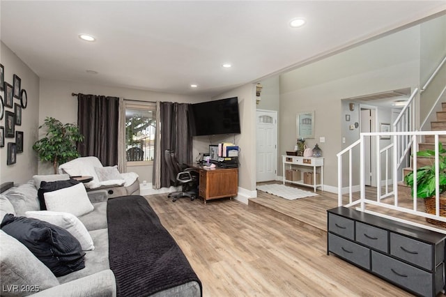 6457 Celeste Ave, Las Vegas, NV 89107 - living room with light wood-style flooring, an office area, stairway, and recessed lighting