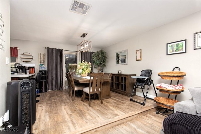 6457 Celeste Ave, Las Vegas, NV 89107 - dining area with wood finished floors