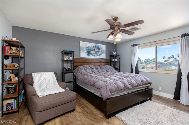 6457 Celeste Ave, Las Vegas, NV 89107 - bedroom with wood finished floors and ceiling fan