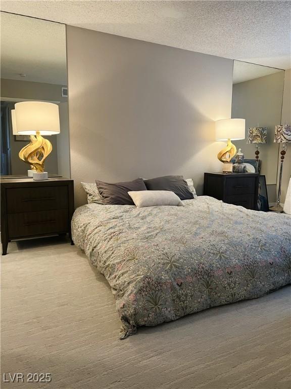 1420 Hialeah Dr Unit D, Las Vegas, NV 89119 - carpeted bedroom with a textured ceiling