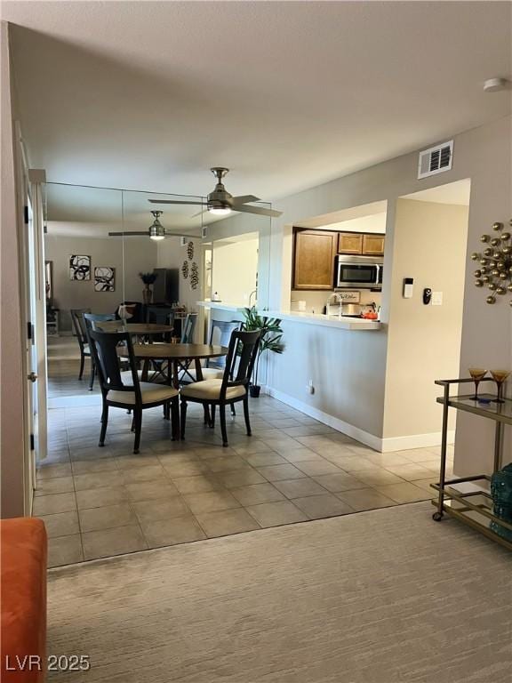 1420 Hialeah Dr Unit D, Las Vegas, NV 89119 - dining room with light tile patterned flooring and ceiling fan