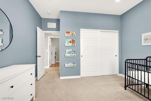 9835 Mojave Mountain St, Las Vegas, NV 89166 - bedroom with light colored carpet, a closet, and a crib