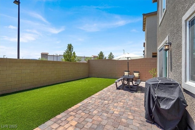 9835 Mojave Mountain St, Las Vegas, NV 89166 - fenced backyard featuring a patio and a grill