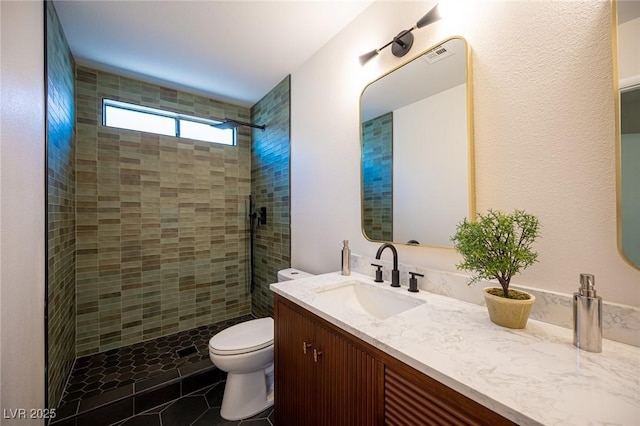 4594 Cabo Ln, Las Vegas, NV 89121 - full bathroom featuring vanity, tiled shower, and tile patterned floors