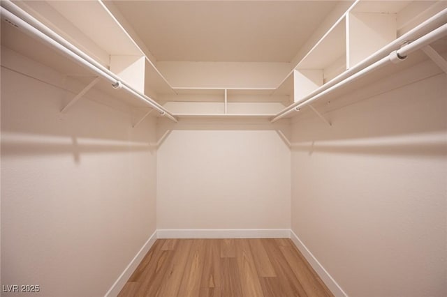4594 Cabo Ln, Las Vegas, NV 89121 - spacious closet featuring wood finished floors