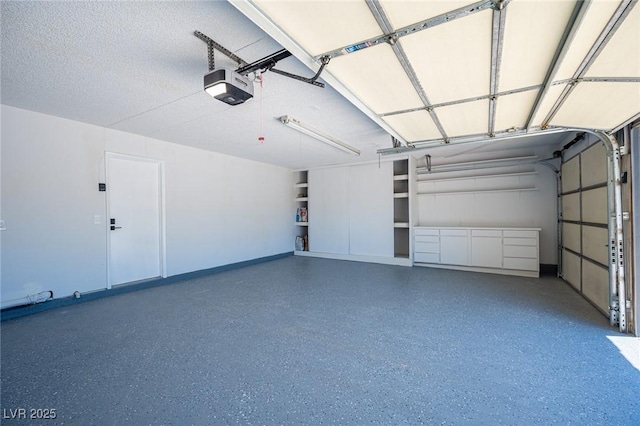 4594 Cabo Ln, Las Vegas, NV 89121 - garage with a garage door opener and baseboards
