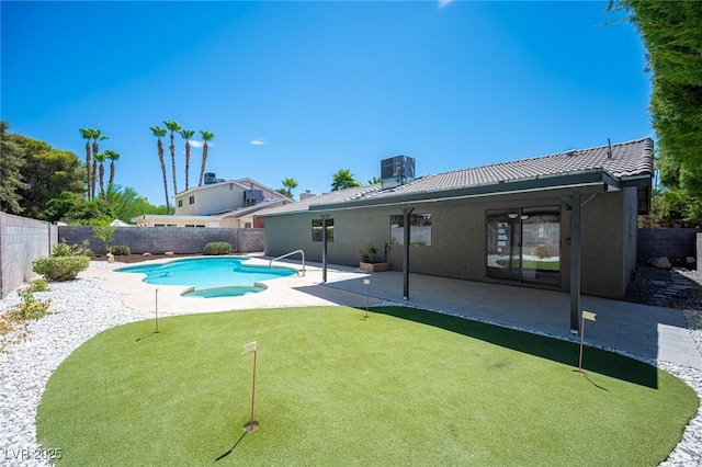 4594 Cabo Ln, Las Vegas, NV 89121 - view of swimming pool featuring a putting area, a fenced backyard, a patio area, and a pool with connected hot tub