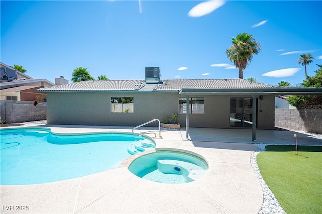 4594 Cabo Ln, Las Vegas, NV 89121 - view of swimming pool with a patio, a putting green, and a pool with connected hot tub