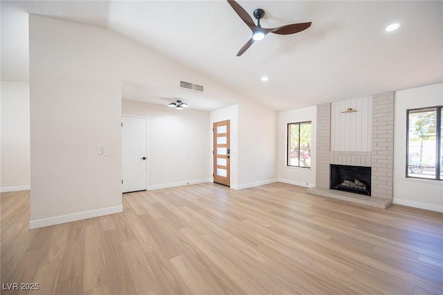 4594 Cabo Ln, Las Vegas, NV 89121 - unfurnished living room featuring vaulted ceiling, plenty of natural light, ceiling fan, light wood-style flooring, and recessed lighting