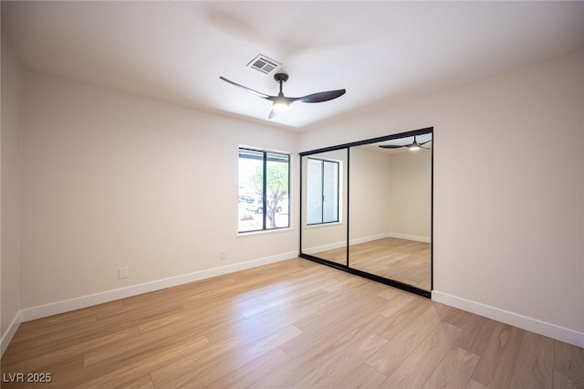 4594 Cabo Ln, Las Vegas, NV 89121 - unfurnished bedroom featuring light wood-style flooring, a closet, and a ceiling fan