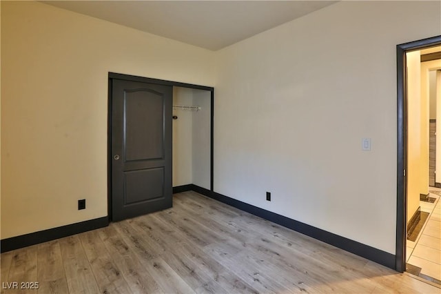 235 Calvino Ave, Las Vegas, NV 89183 - unfurnished bedroom with light wood finished floors and a closet