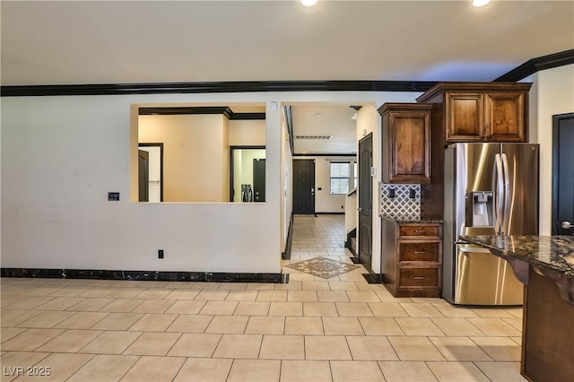 235 Calvino Ave, Las Vegas, NV 89183 - kitchen with stainless steel fridge, ornamental molding, dark stone countertops, recessed lighting, and decorative backsplash