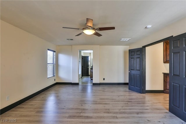 235 Calvino Ave, Las Vegas, NV 89183 - spare room featuring ceiling fan, light wood-style flooring, and a smoke detector