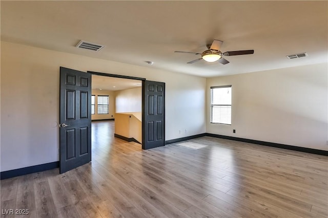 235 Calvino Ave, Las Vegas, NV 89183 - spare room with healthy amount of natural light, light wood-type flooring, and ceiling fan