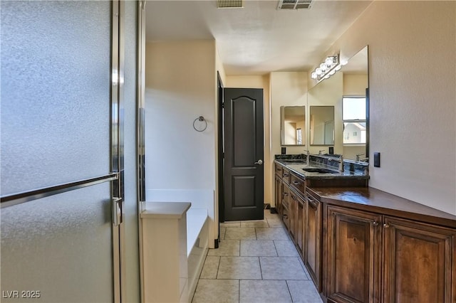 235 Calvino Ave, Las Vegas, NV 89183 - full bath with double vanity, a bath, and tile patterned flooring