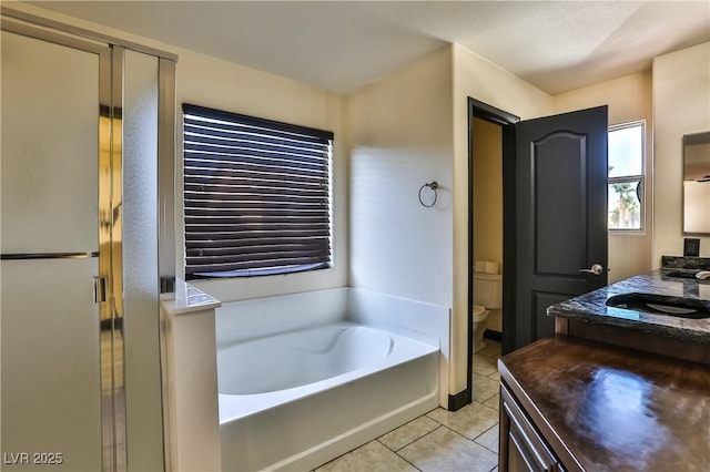 235 Calvino Ave, Las Vegas, NV 89183 - full bath with vanity, tile patterned floors, a garden tub, and a shower stall