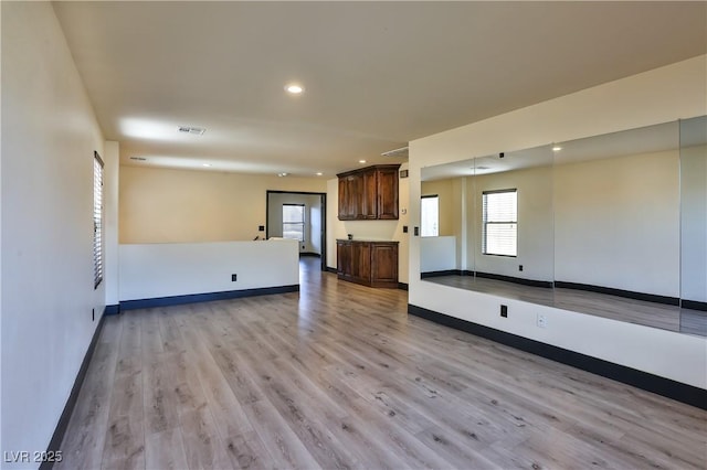 235 Calvino Ave, Las Vegas, NV 89183 - unfurnished living room with light wood-style floors and recessed lighting