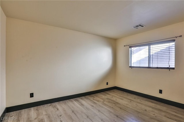 235 Calvino Ave, Las Vegas, NV 89183 - spare room featuring baseboards and wood finished floors