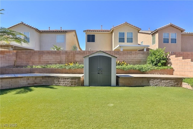 235 Calvino Ave, Las Vegas, NV 89183 - fenced backyard with a storage unit