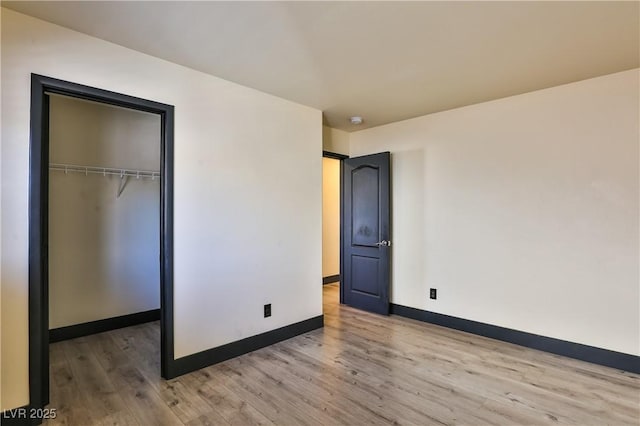 235 Calvino Ave, Las Vegas, NV 89183 - unfurnished bedroom featuring wood finished floors and a closet